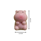 A small pink hippo figurine centered on a white background, with black dimension arrows and text showing 2.5 cm height and 1.